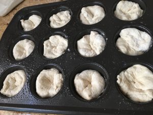 indent in dough in muffin pan