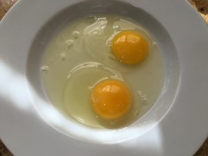 Beat 2 eggs in serving dish